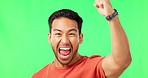 Man, excited with fist pump and celebration on green screen, winning and success with happiness. Portrait, yes and male with achievement, mockup with cheers and winner energy on studio background