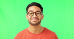 Face, glasses and vision with a man on a green screen background in studio laughing at his sense of sight. Portrait, eyewear and prescription frame lenses with a handsome young male on chromakey