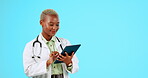 Tablet, typing and doctor woman isolated on studio background with telehealth or medical research mockup. African healthcare person working on digital technology and happy with online or web results