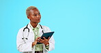 Tablet, thinking and doctor woman isolated on studio background telehealth ideas or clinic service app. African person typing in healthcare research, contemplating digital solution and medical mockup
