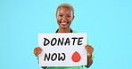 Smile, nurse and black woman with donation poster in studio isolated on a blue background mockup. Face portrait, surgeon and person with charity sign for blood, medical help and donate organ.