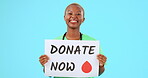 Nurse, happy and black woman with donate poster in studio isolated on a blue background mockup. Face portrait, surgeon and person with charity sign for blood, medical help and organ donation.