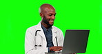 Laptop, doctor typing and black man on green screen in studio isolated on mockup background. Medical professional, computer and happy person or surgeon with online healthcare, telehealth or research.