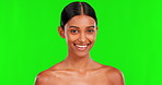 Beauty, smile and a woman on a green screen background in studio for natural skincare cosmetics. Portrait, skin and antiaging treatment with a happy young female model advertising on chromakey mockup