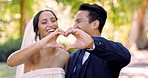 Heart, hands and happy wedding of couple in park for love, care and commitment to life partnership. Closeup, bride and groom with finger shape of support, trust and emoji of union, marriage and sign