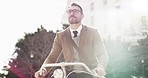 Happy business man, city and bicycle for sustainable traveling in sunshine, outdoor and flare. Worker, bike and thinking of eco friendly transportation, carbon footprint or happiness in urban journey