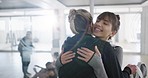 Fitness, hug and friends at yoga class with personal trainer for sports, wellness or meditation in health studio. Workout, welcome and women embrace before pilates, exercise or training at gym