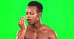 Green screen, man and check bad breath for hygiene routine, poor dental health and oral wellness. Mouth, black male person and breathing on hands for smelling odor, bacteria and halitosis problem 