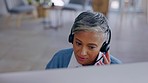 Senior woman, call center and talk with microphone, computer and listen for customer service in office. Female crm consultant, telemarketing or technical support for advice with voip communication
