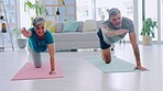 Yoga, meditation and senior couple in the lounge stretching and workout for wellness, stress relief and zen. Partners, man and woman at home, pilates training and peace to relax and healthy lifestyle