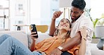 Couple, phone and relax on couch with social media app, blog or funny video on web in home. Man, woman and smartphone on sofa with conversation, reading and laughing with communication on internet