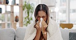 Sick woman, blanket and sneeze of nose for cold, allergies and winter virus in living room. Young female person sneezing for health problem, covid risk and allergy of sinusitis, infection and disease