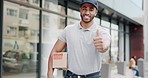 Delivery man, smile and thumbs up for success, ecommerce, shipping or package in city. Portrait of happy male in logistics showing thumb emoji for yes sign, like or approval with parcel box in town