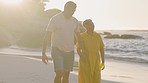 Senior couple, beach and holding hands on walk with romance, conversation and sunset on holiday. Man, woman and freedom by ocean with love, bonding and talk together in summer on retirement vacation