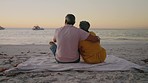 Back, sunset and senior couple on a beach, love and bonding with quality time, relax and romantic. Partners, man and woman on a seaside holiday, summer or vacation with a view, traveling and marriage