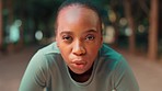 Face closeup, tired woman and park with fitness rest on a nature trail breathing from run. Runner, workout and female and exercise fatigue of a sprinter on a path for cardio and wellness training