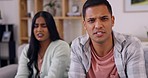 Argument, angry and face of a couple in their living room with relationship problems to break up. Upset, psychology and portrait of a young man and woman fighting in a therapy session for divorce.