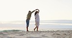 Love, happy and couple dance at beach for romance, bonding and quality time on weekend by ocean. Nature, dating and man and pregnant woman kiss, dancing and together on holiday, vacation or honeymoon