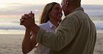 Love, happy and couple dance at beach for romance, bonding and quality time on weekend by ocean. Nature, dating and man and woman dancing together by sea on holiday, vacation and honeymoon at sunset