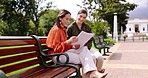 Park, professional women and bench with paperwork and document planning for creative project. Share ideas, collaboration and female worker talking with notebook plan and brainstorming outdoor