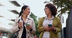 Conversation, walking and business women in the city talking and bonding on their way to work. Communication, happy and corporate female friends speaking while commuting to the office in urban town.