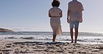 Love, travel and couple walking on the beach together while a vacation, adventure or weekend trip. Romance, outdoor walk and young man and woman by the ocean while on a tropical holiday  in Mexico.