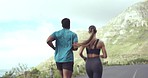 Fitness, running and couple workout on a mountain road for exercise and partner run. Outdoor, cardio and woman runner with a man back with marathon jog and speed movement on a street for sports