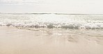 Beach, waves and sand in outdoor landscape with space for mock up, sunshine or summer with handheld movement. Ocean, water and low angle with tropical mockup for holiday, vacation or island adventure