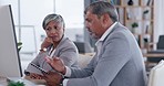 Business people, documents and planning on computer for strategy, brainstorming or ideas at the office desk. Senior businessman and woman discussing paperwork, project plan or idea on desktop PC