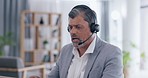 Businessman, call center and consulting with headphones for customer service, support or telemarketing at office. Serious man consultant or agent talking with headset for online advice or contact us