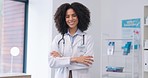 Face, woman and doctor with arms crossed, smile and success in hospital, happiness and confidence. Portrait, happy female employee and medical professional with joy, healthcare and wellness in clinic