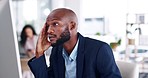 Stress, headache and businessman in the office while working on a corporate project with computer. Frustration, migraine and professional African male employee doing research on a pc in the workplace