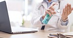 Woman, doctor and hands on laptop with sanitizer for disinfection, hygiene or germ removal at the office desk. Hand of female medical expert spraying or cleaning bacteria before typing on computer