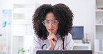 Serious, woman and doctor thinking at laptop in medical office, research and reading online report. Face of confused female healthcare worker with glasses at computer for problem solving information