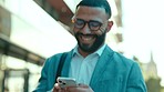 Phone, texting and business man smile in the city on a street walking with happiness. Outdoor, walk and mobile networking of a businessman happy on a social media and web app on the internet