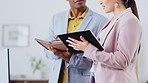 Tablet, notebook and business people in discussion in the office doing research for a project. Collaboration, teamwork and corporate team working on a report together with mobile device in workplace.