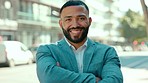 Business man, face smile and arms crossed of a male employee feeling success in a city. Urban businessman, happiness and outdoor of a young worker ready for work and management with job pride