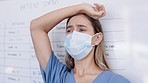 Doctor, sad woman and stress with face mask in burnout, anxiety or failed surgery at hospital. Upset or unhappy female medical professional suffering loss, grief or headache from overworked at clinic