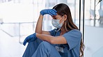 Doctor, sad woman and stress with face mask crying in grief, loss or failed surgery at hospital. Upset or unhappy female medical professional suffering from anxiety, depression or failure at clinic