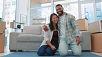 Happy couple, roll carpet together and new home with game, playing and bond with love for goal. Man, woman and happiness for young homeowner, achievement and comic with boxes, flooring and laughing