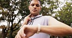 Fitness, watch and pulse check of a man in a park rest after workout run and exercise. Time, athlete and smartwatch of a person checking wellness, heart rate and run progress on a training app