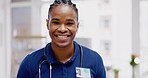 Black man, doctor and smile on face in clinic for healthcare services, excited or happy for job. African medic, male nurse and happiness in portrait for wellness service, medical career or workplace