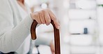 Hand, walking stick and closeup for woman in living room, nursing home or hospital for mobility support. Cane, crutch or rehabilitation for disability, stroke or injury for elderly lady with problem