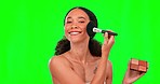 Makeup brush, palette and face of woman on green screen for wellness, beauty and cosmetics in studio. Cosmetology, glow and happy girl with brushes for eyeshadow application, foundation and glamour