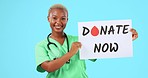 Face, black woman and doctor with a poster, donate now and happiness against a blue studio background. Portrait, female person and medical professional with sign, blood drop and paper for information