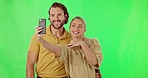 Happy couple, ring and engagement selfie on a green screen isolated on a studio background. Excited, love and a man and woman getting engaged and taking a photo for a memory and commitment together