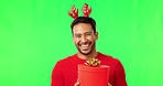 Christmas gift, man portrait and green screen with holiday party hat and happiness with laugh. Isolated, studio background and Asian male person with happy face and present at festive event