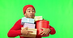 Excited face, Christmas gift and man on a green screen isolated on a studio background. Smile, celebration and portrait of an Asian person carrying presents for the festive season after shopping