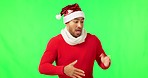 Christmas dance, man and green screen with hat feeling happy for promotion, deal or holiday sale. Isolated, studio background and person dancing with happiness for festive winter celebration