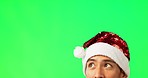 Man, think and christmas with green screen in studio by mock up space for holiday promotion. Guy, festive fashion and portrait with excited face, search and looking up with mockup for celebration